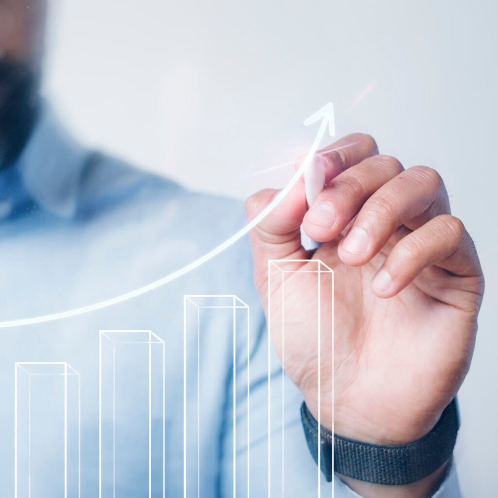 Hand drawing a rising bar chart with an upward arrow, representing ad campaign growth